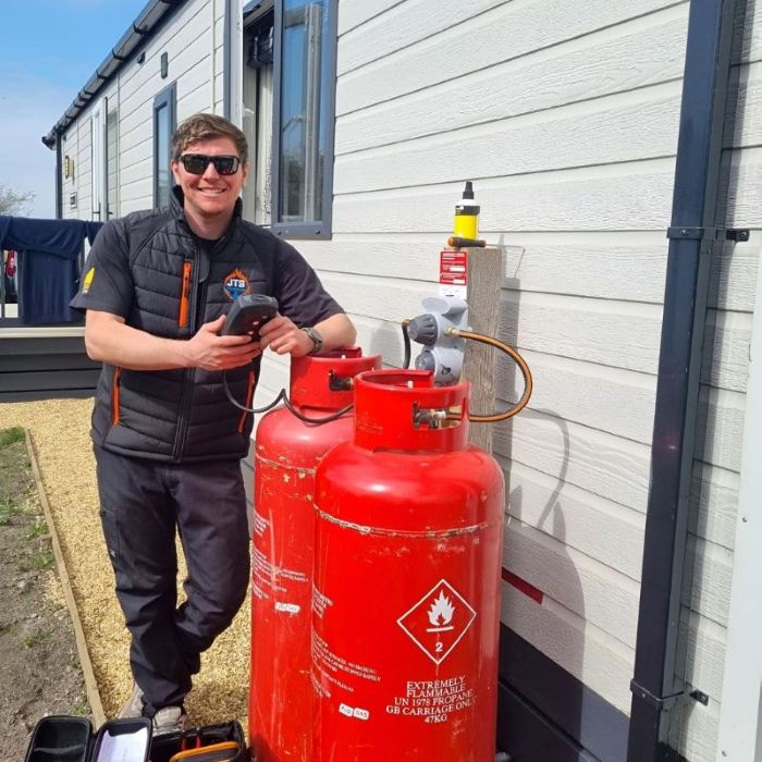 Jack from JTS LPG Services carrying out LPG work at a static caravan on Anglesey