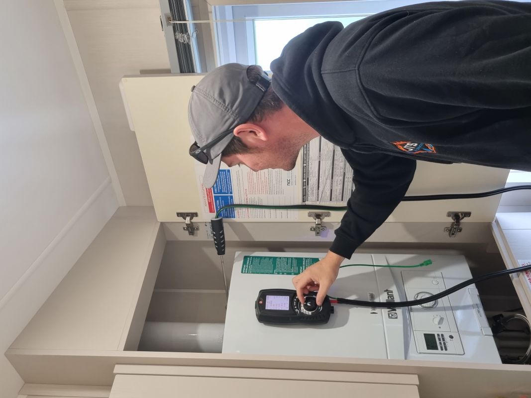 Jack from JTS LPG Services carrying out combustion analysis on an LPG boiler