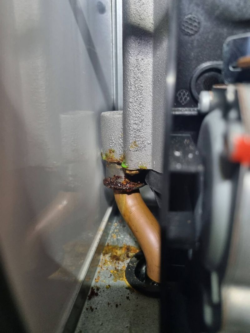 Internal LPG caravan boiler pipework checked during maintenance