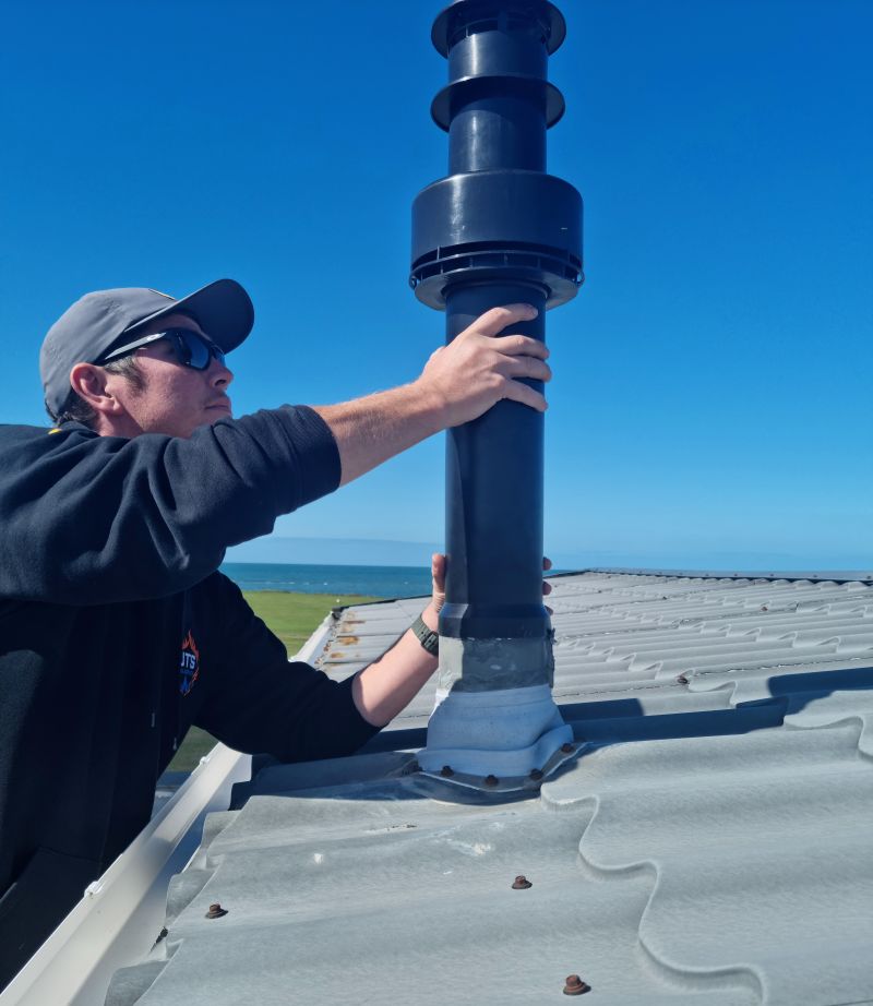 Jack from JTS LPG Services installing a flue on a static caravan