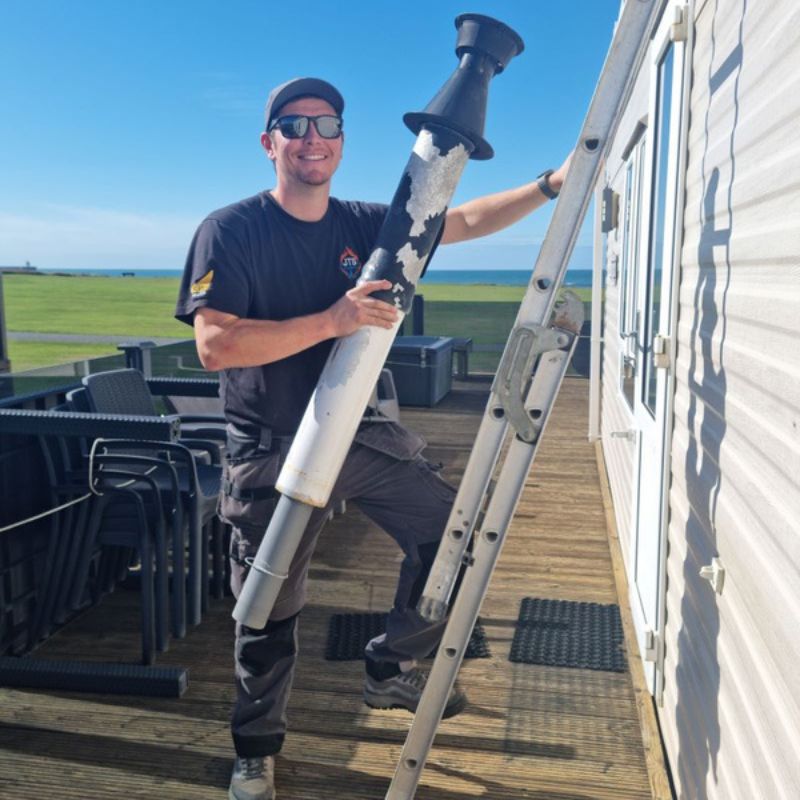 Jack from JTS LPG Services removing an old static caravan boiler flue